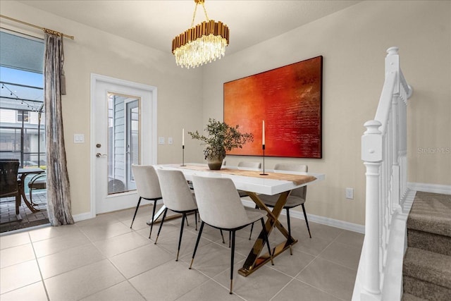 tiled dining space with a notable chandelier