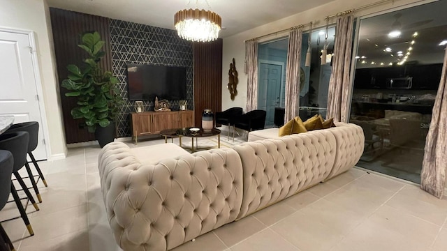 living room with light tile patterned flooring and a chandelier