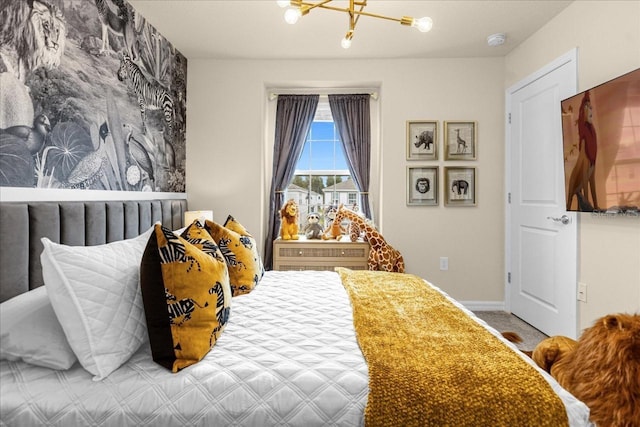 carpeted bedroom featuring a chandelier