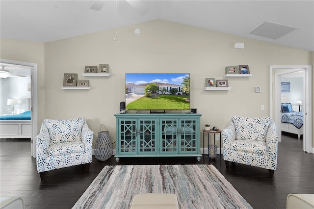 living room with dark hardwood / wood-style floors and vaulted ceiling