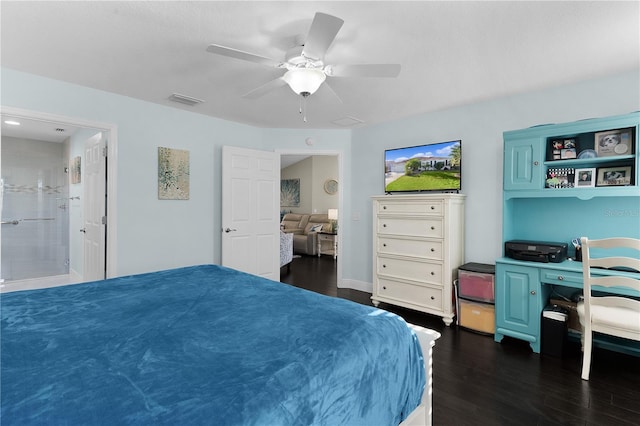 bedroom featuring connected bathroom, ceiling fan, and dark wood-type flooring