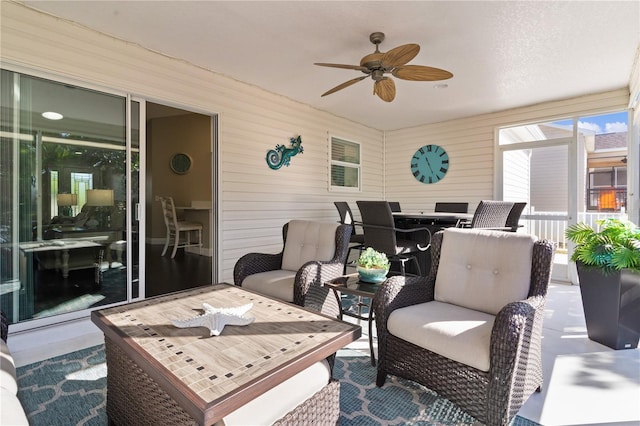 view of patio / terrace featuring ceiling fan and an outdoor living space