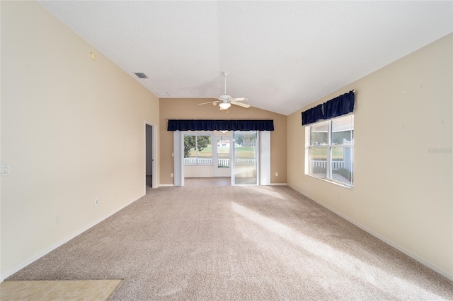 unfurnished living room with light carpet, ceiling fan, and lofted ceiling