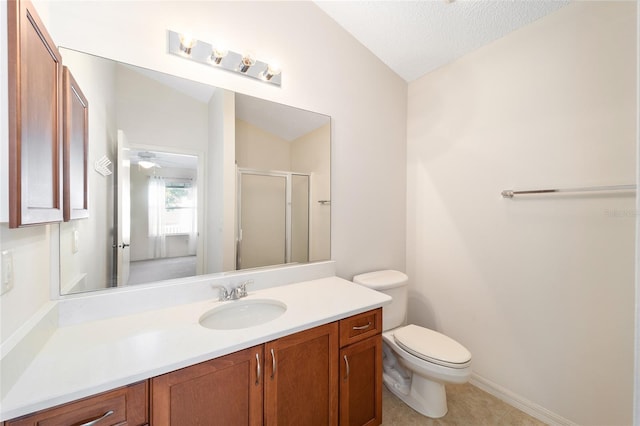 bathroom featuring vanity, lofted ceiling, a textured ceiling, and walk in shower