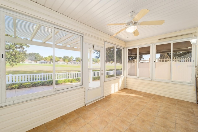 unfurnished sunroom with ceiling fan and wood ceiling