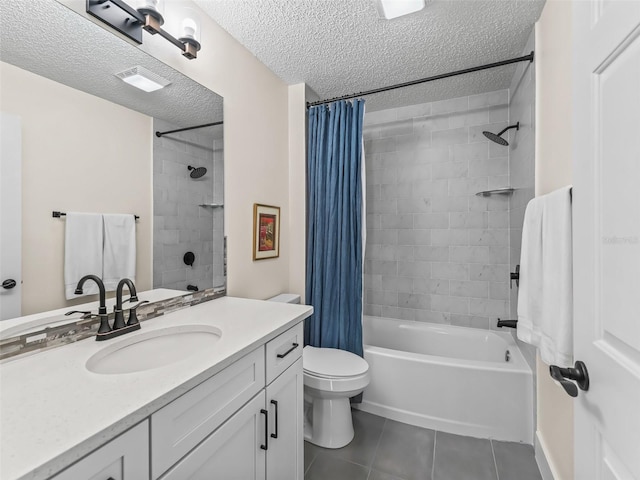 full bathroom with tile patterned floors, vanity, a textured ceiling, shower / tub combo with curtain, and toilet