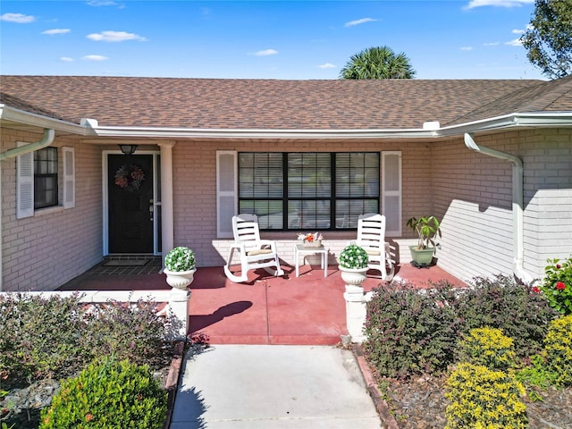 property entrance with covered porch