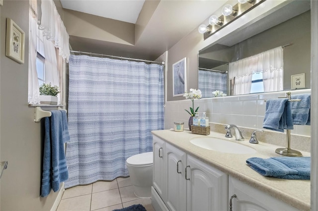 bathroom with tile patterned floors, vanity, and toilet