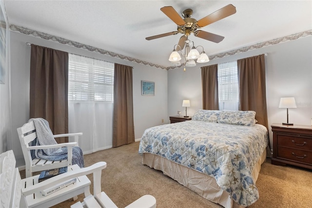 bedroom with light carpet and ceiling fan