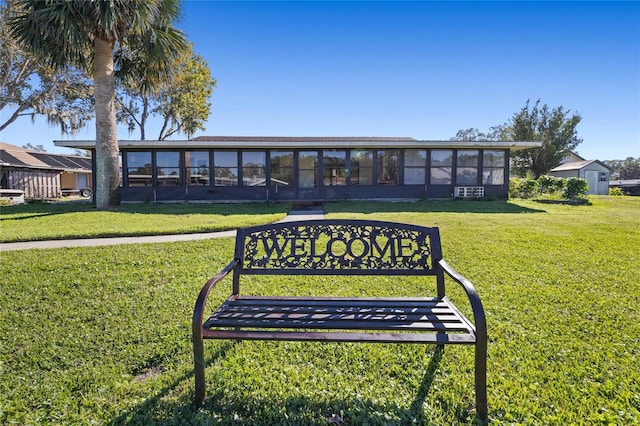 view of property's community with a lawn