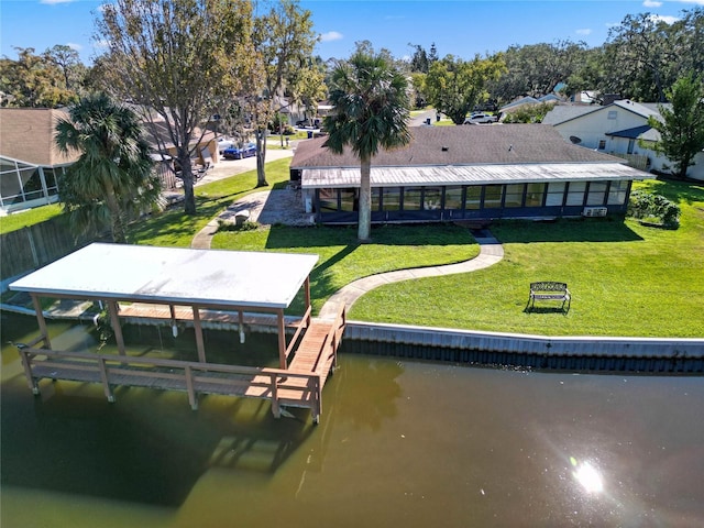 view of dock featuring a yard and a water view