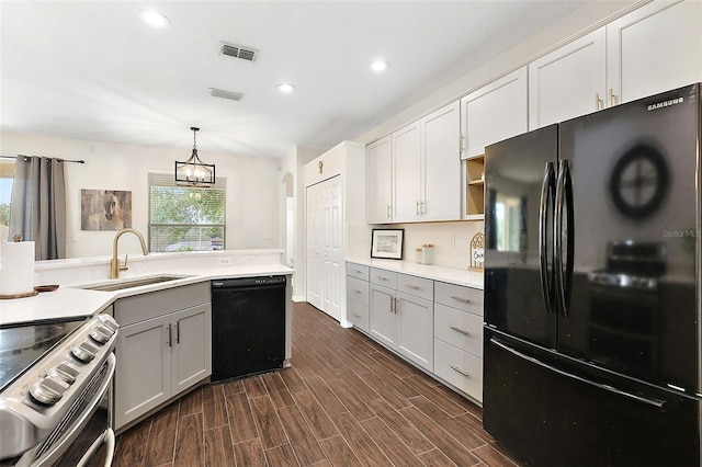 14701 Timucua Pl, Clermont, FL 34711 - kitchen with black appliances, recessed lighting, light countertops, hanging light fixtures, and gray cabinetry