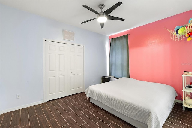 bedroom with a closet, ceiling fan, and dark wood-type flooring