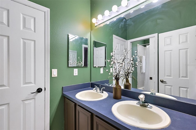 14701 Timucua Pl, Clermont, FL 34711 - bathroom with double vanity, a shower with shower curtain, and a textured wall