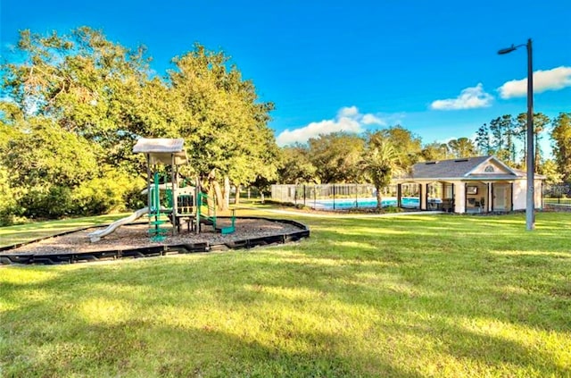 view of playground featuring a yard