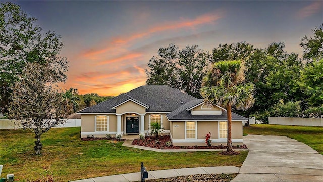 view of front of home with a yard