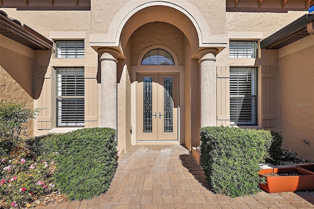 property entrance featuring french doors