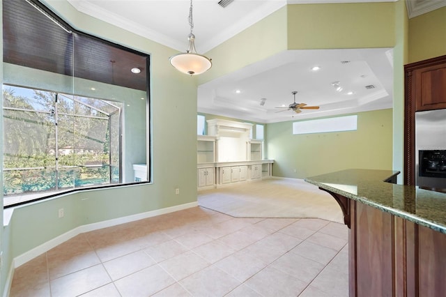 kitchen featuring stainless steel refrigerator with ice dispenser, decorative light fixtures, a raised ceiling, and ceiling fan