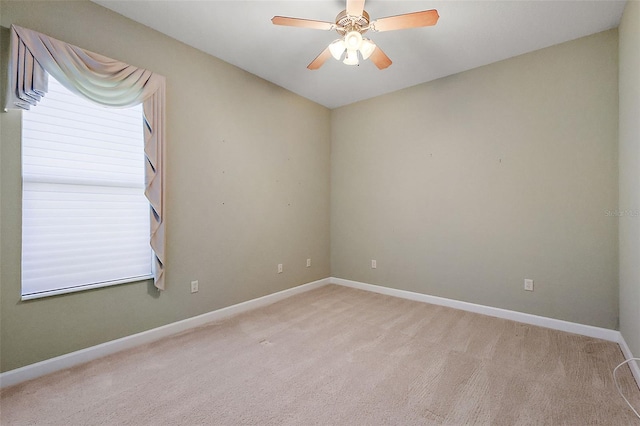 carpeted empty room with ceiling fan