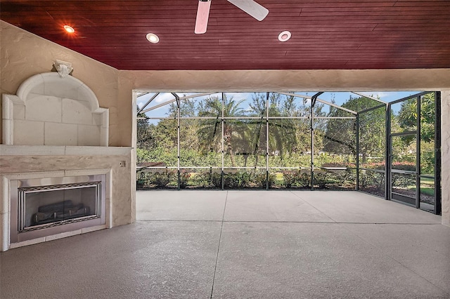 view of patio / terrace featuring a fireplace and ceiling fan