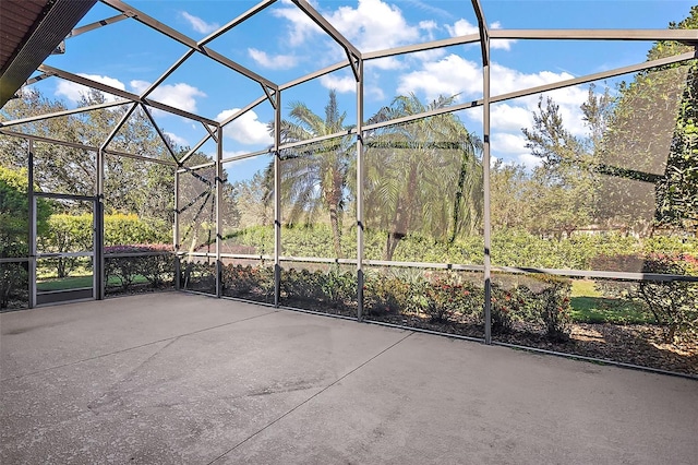 view of patio / terrace featuring glass enclosure