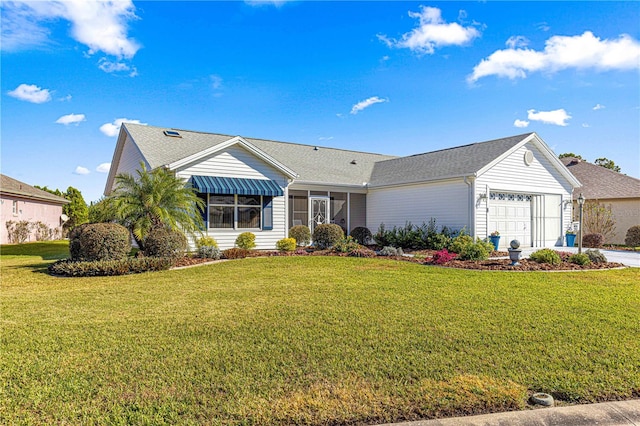 ranch-style house with a front yard and a garage