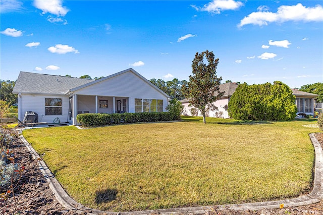 ranch-style home featuring a front yard