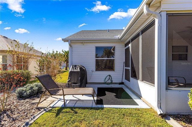 view of patio featuring a sunroom