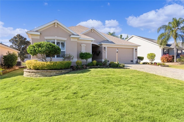 ranch-style home with cooling unit, a garage, and a front lawn