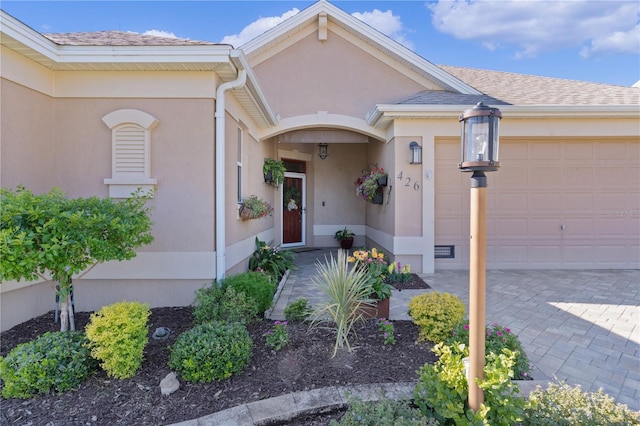 entrance to property featuring a garage