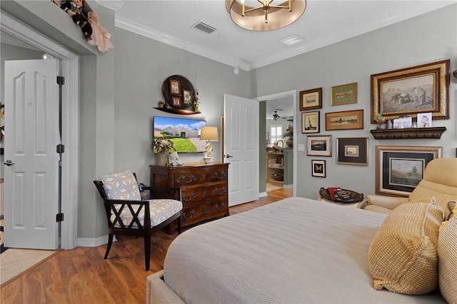 bedroom featuring hardwood / wood-style floors and ornamental molding