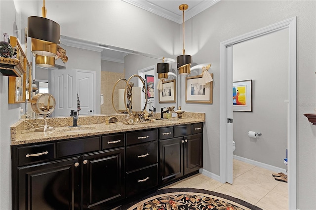 bathroom featuring vanity, toilet, tile patterned flooring, and ornamental molding