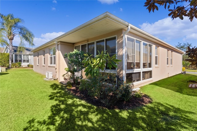 rear view of property with a yard