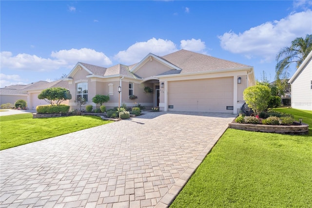 single story home with a front yard and a garage