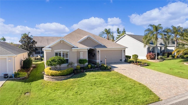 ranch-style home featuring a garage and a front yard