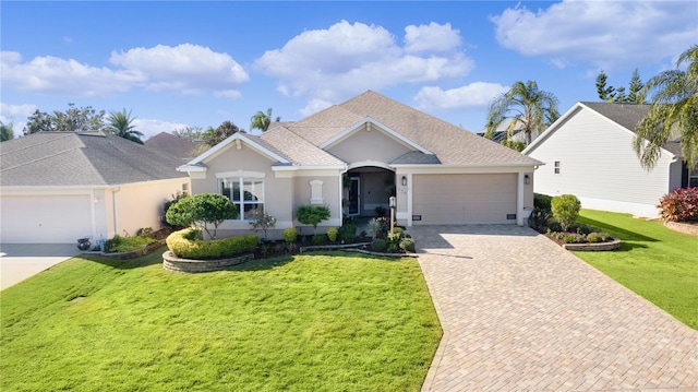 single story home with a garage and a front lawn