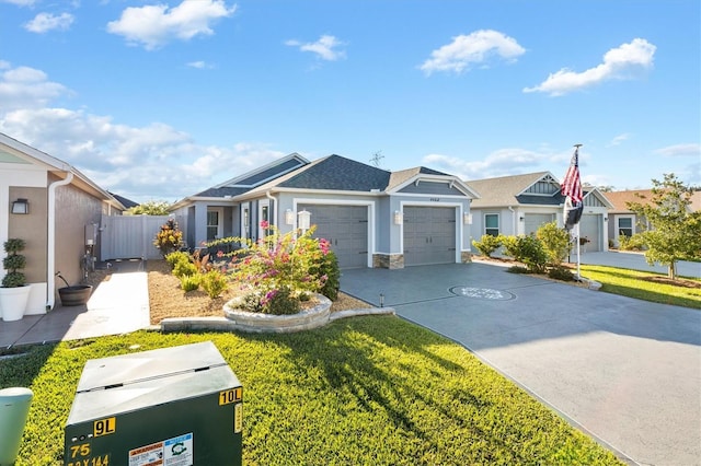 view of front of home with a garage and a front lawn