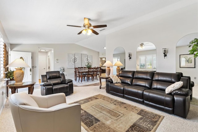 living room with ceiling fan, carpet, and lofted ceiling