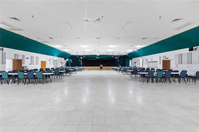 misc room featuring light tile patterned floors and ceiling fan