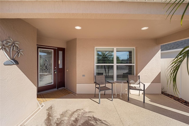 entrance to property featuring a patio area