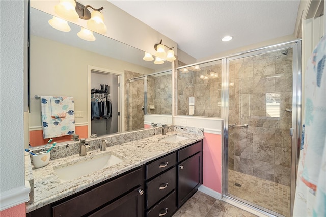 bathroom with vanity, tile patterned floors, and walk in shower