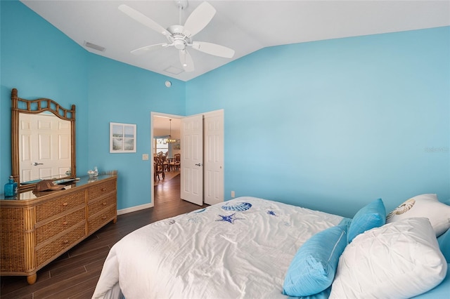 bedroom featuring ceiling fan, dark hardwood / wood-style floors, and lofted ceiling