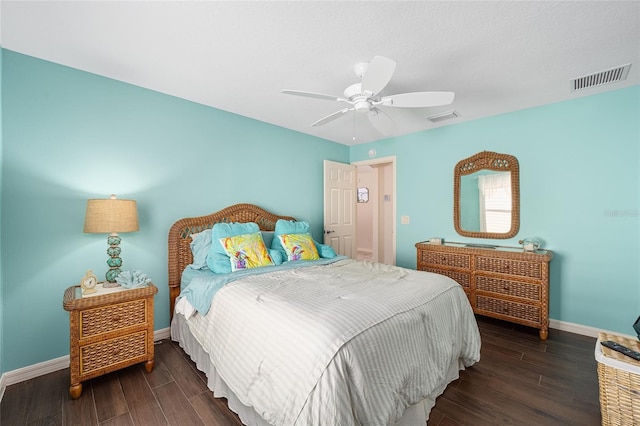 bedroom with ceiling fan and dark hardwood / wood-style floors