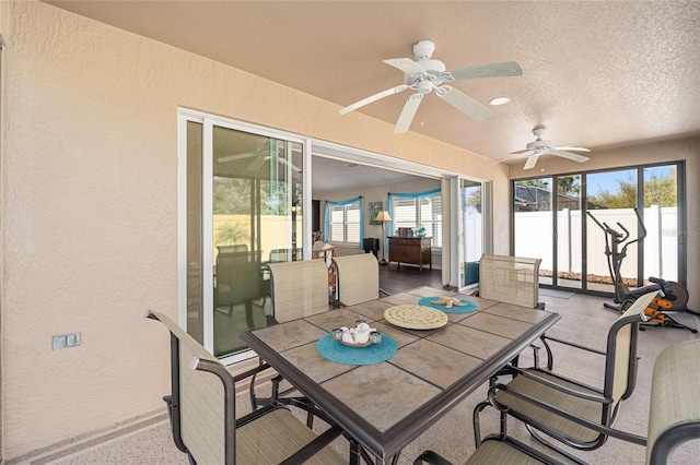 sunroom featuring ceiling fan