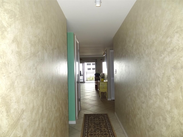 hallway featuring light tile patterned floors