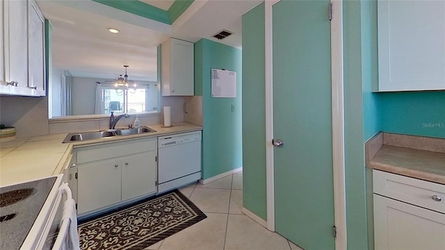 kitchen featuring sink, pendant lighting, a notable chandelier, dishwasher, and white cabinetry