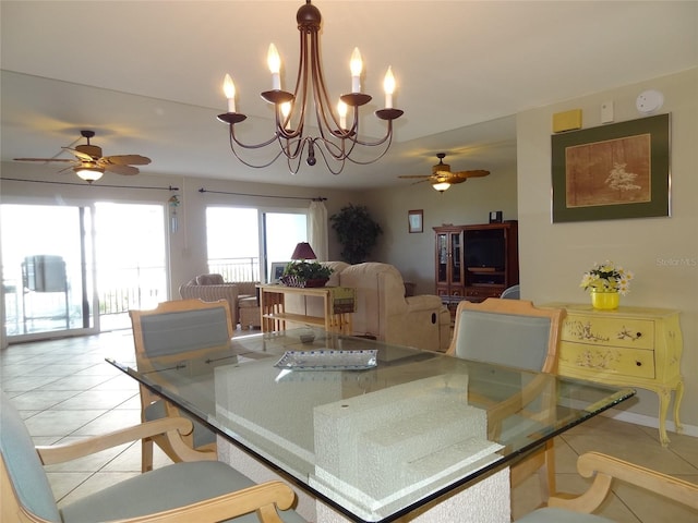 dining room with light tile patterned floors and ceiling fan with notable chandelier