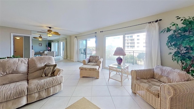 tiled living room with ceiling fan