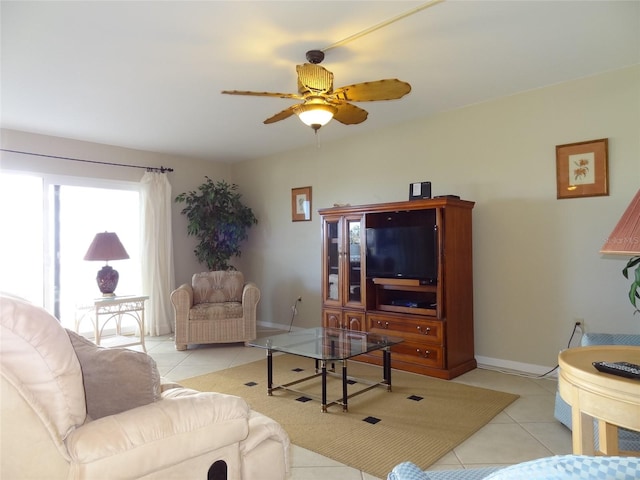 living room with ceiling fan and light tile patterned floors