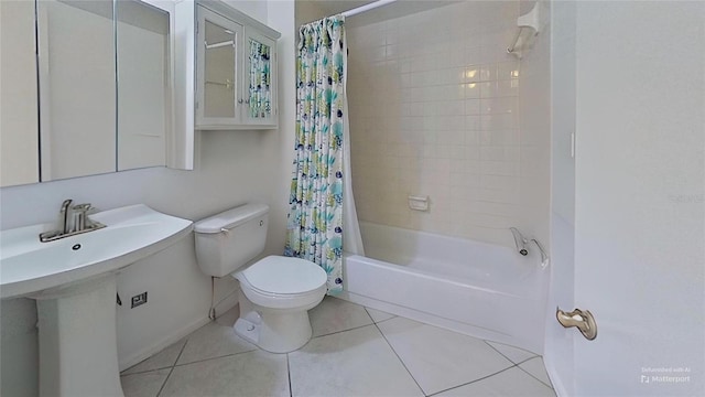 full bathroom featuring tile patterned floors, sink, shower / bathtub combination with curtain, and toilet